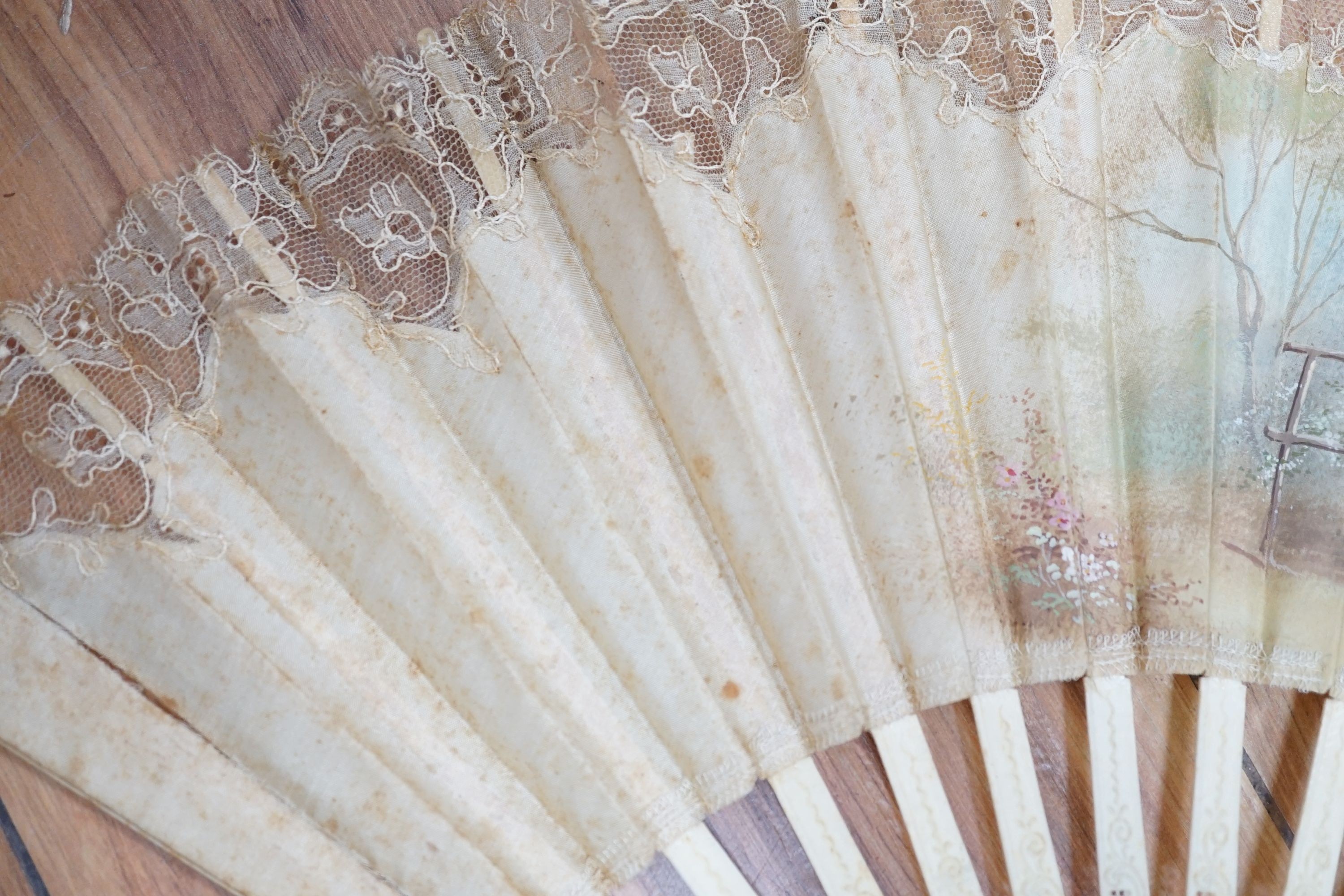 Five various fans, and an 18th century painted leaf fan with ivory chinoiserie decorated guards and sticks, 28 cms high (6)